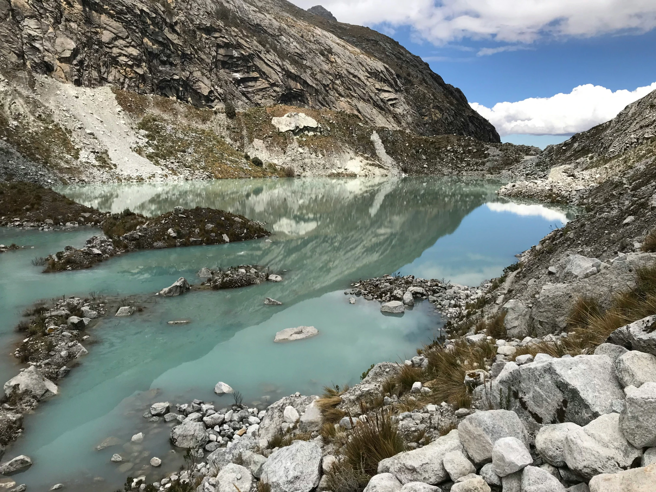 a blue lake surrounded by rocks and mountains