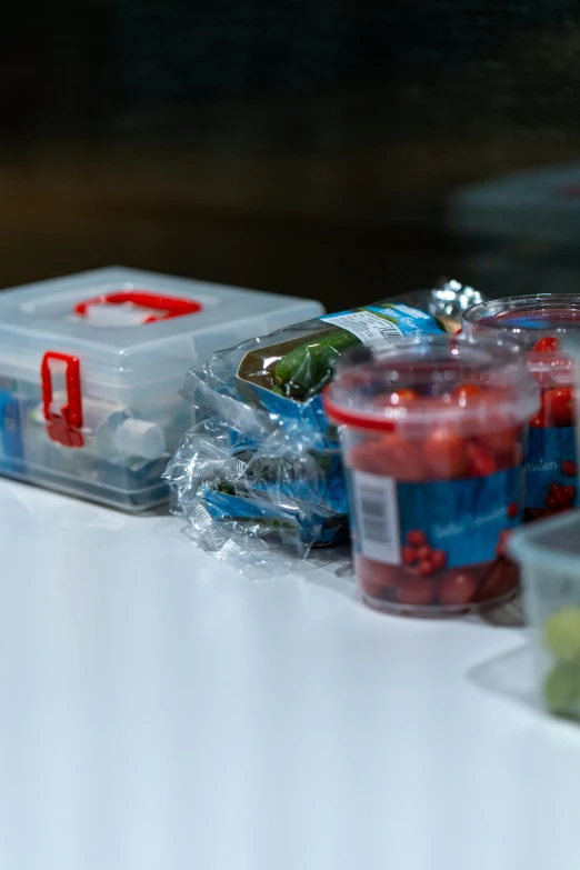 a table filled with small containers and containers of food