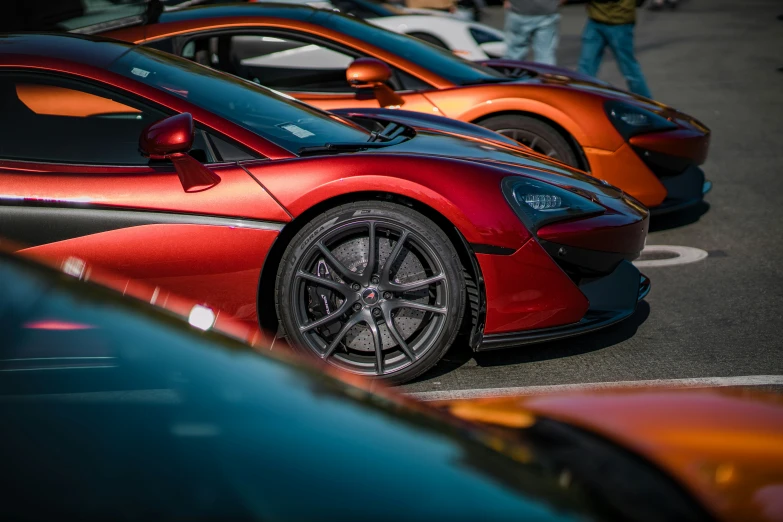 some cars are lined up on the side of the road