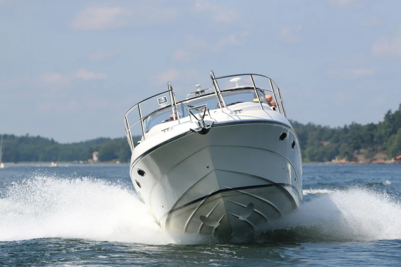 a boat on the water being driven by a waker