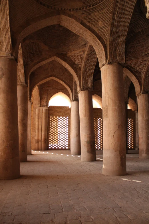 the inside of an old building with brick columns