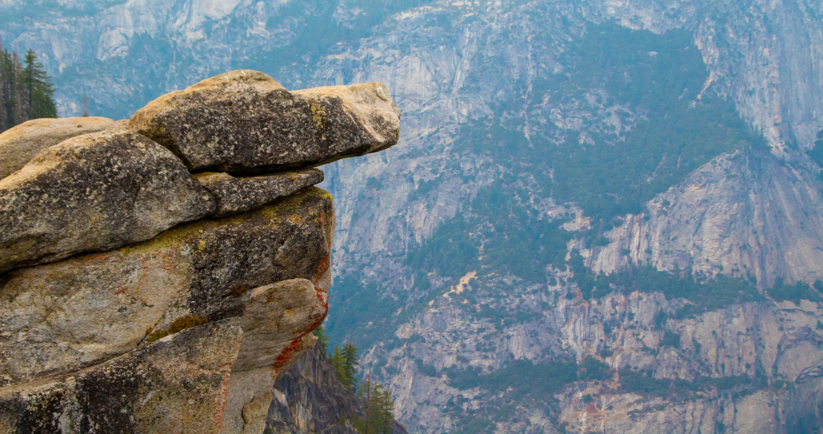 a cliff formation with an ocean in the background