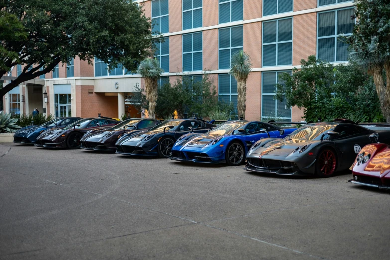 this is a parking lot with a row of racing cars