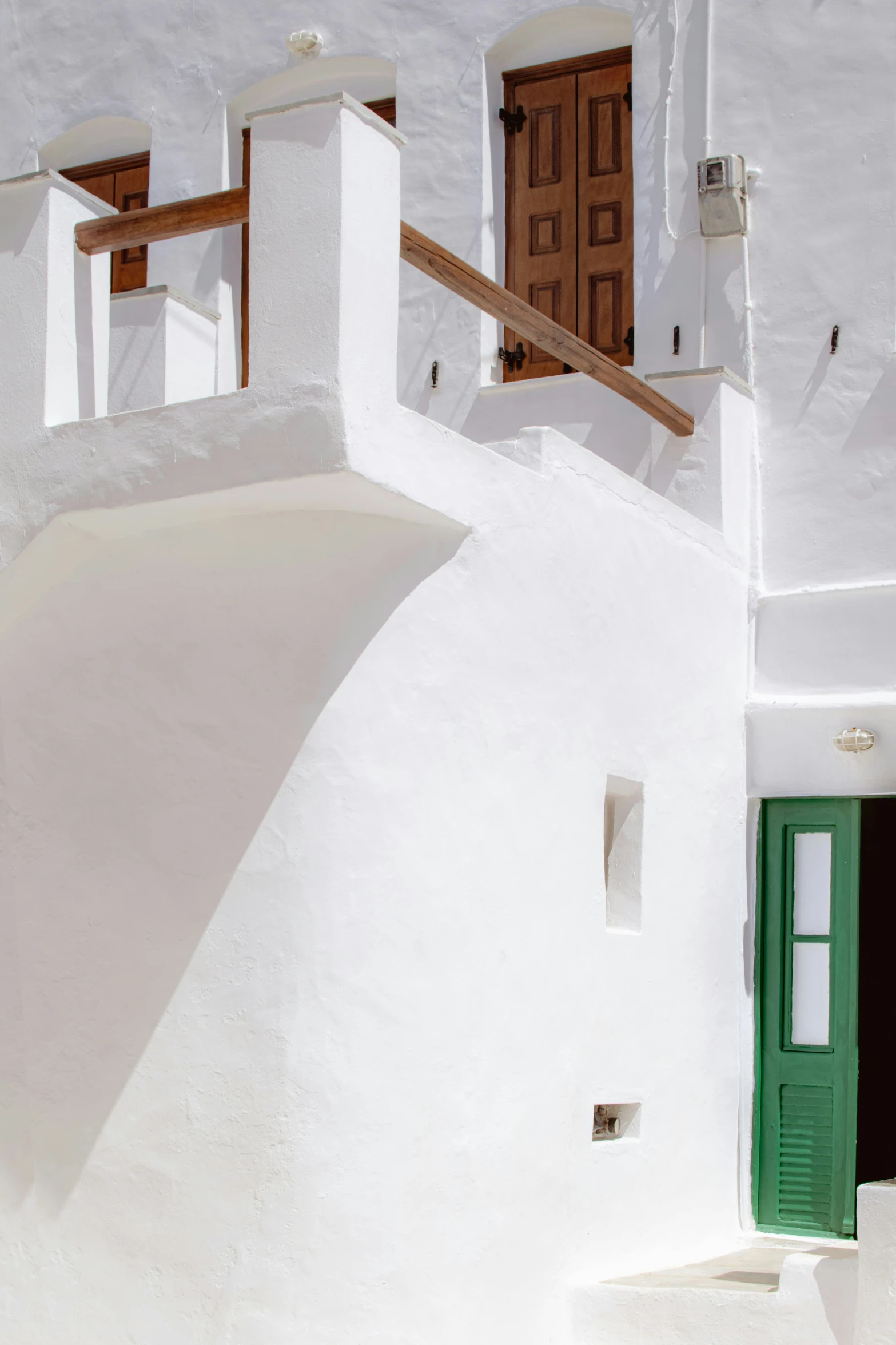 an image of a building with a green door and window