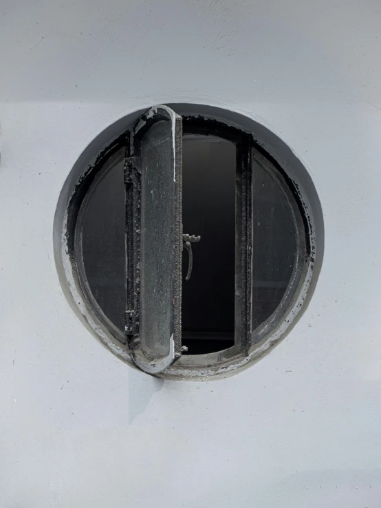 round window with opening on outside of wall