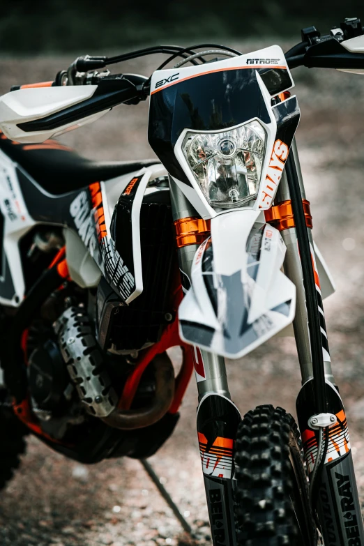 closeup of a dirt bike parked in a driveway