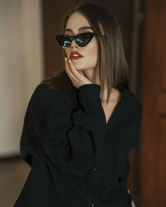 the woman with the sunglasses is posing for a portrait