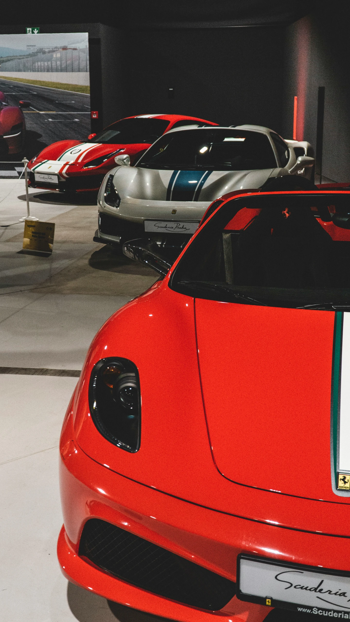 some cars lined up next to each other in a garage