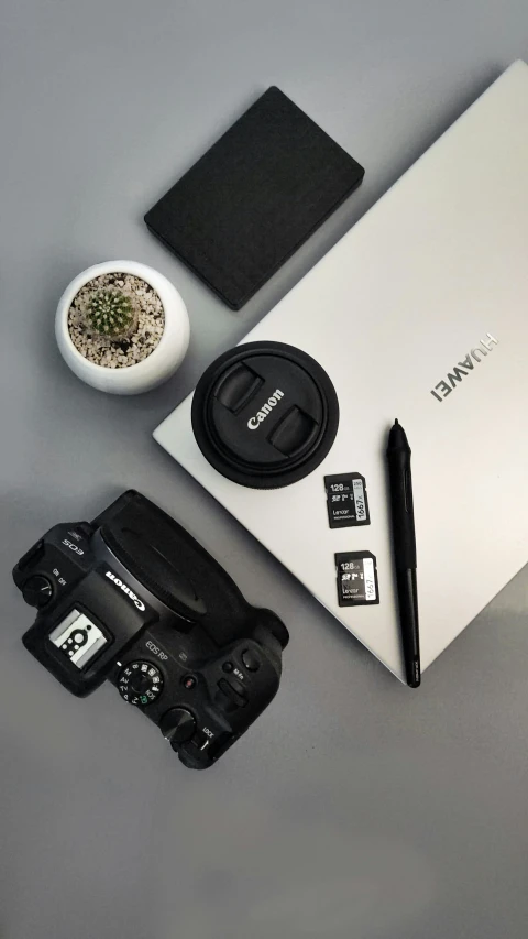 a camera on a table with various accessories