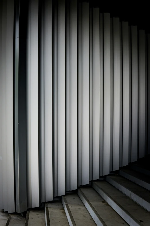 steps and the side of a building have closed shutters