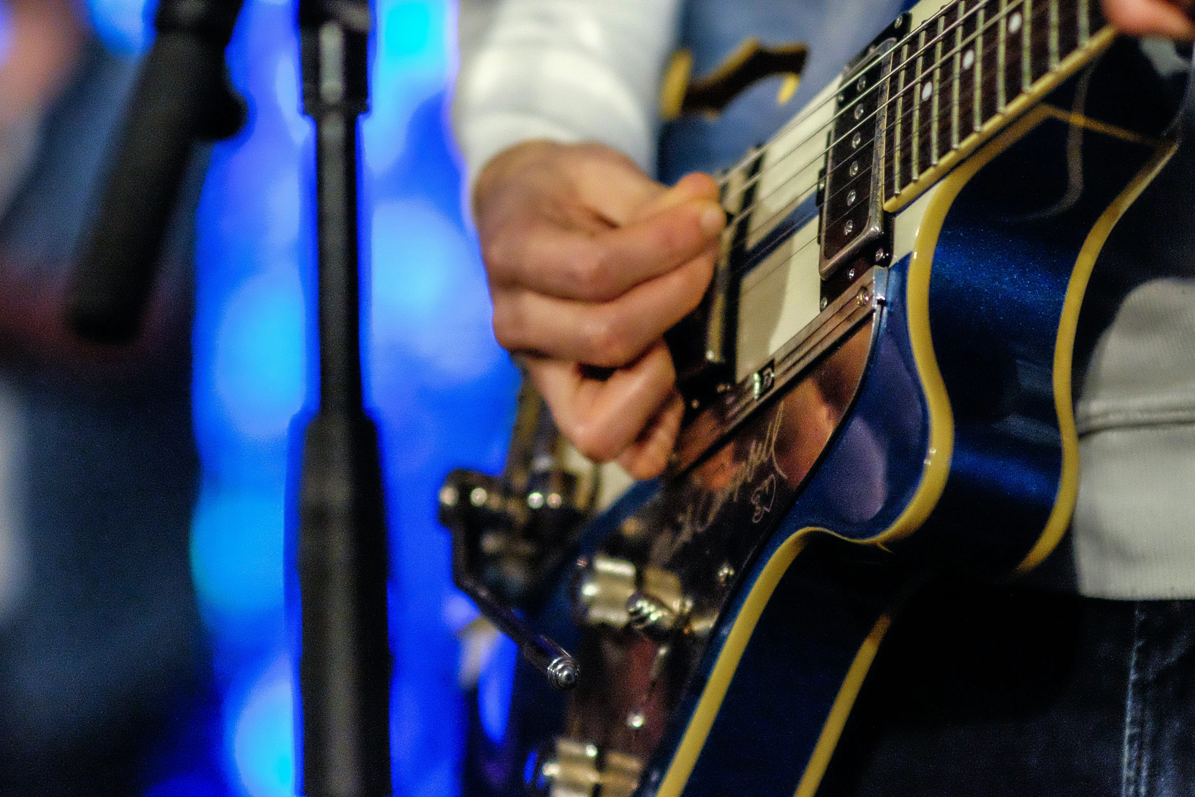 close up s of a person playing a guitar