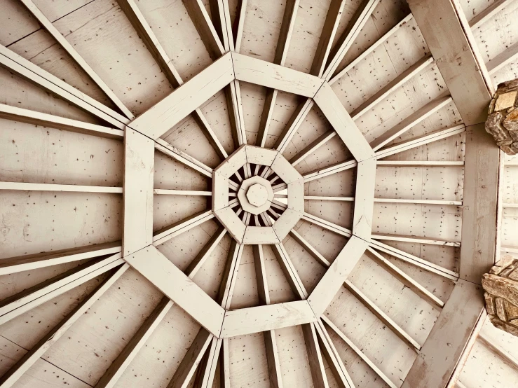 the ceiling of a tall building is covered in white cement