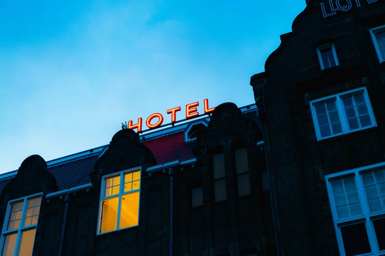 an ornate building with illuminated signs in the windows