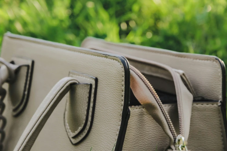 an elegant gray bag sits on a sunny day