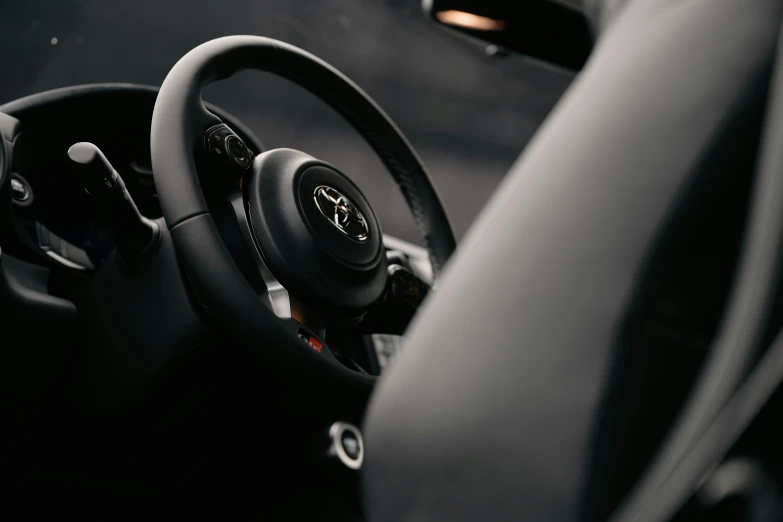 the steering wheel and dashboard of a minivan