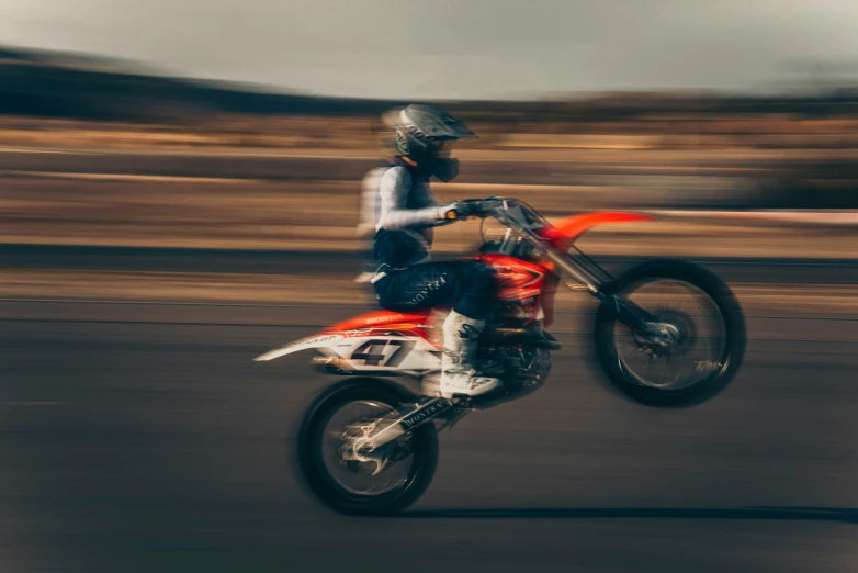 a person on a motorbike in the street