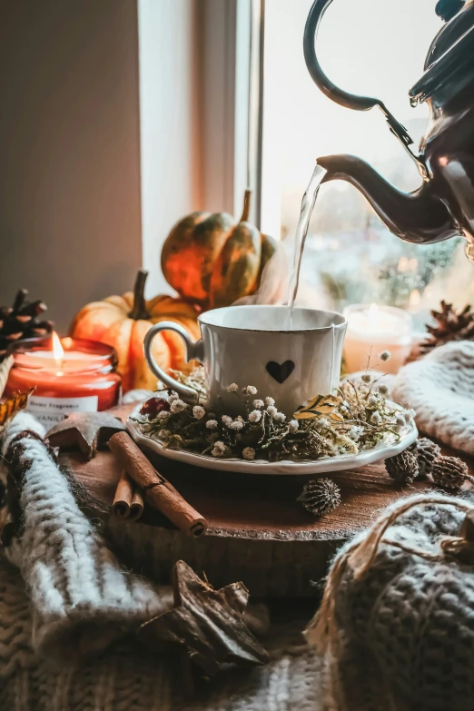 a tea pot filled with water sitting on top of a plate