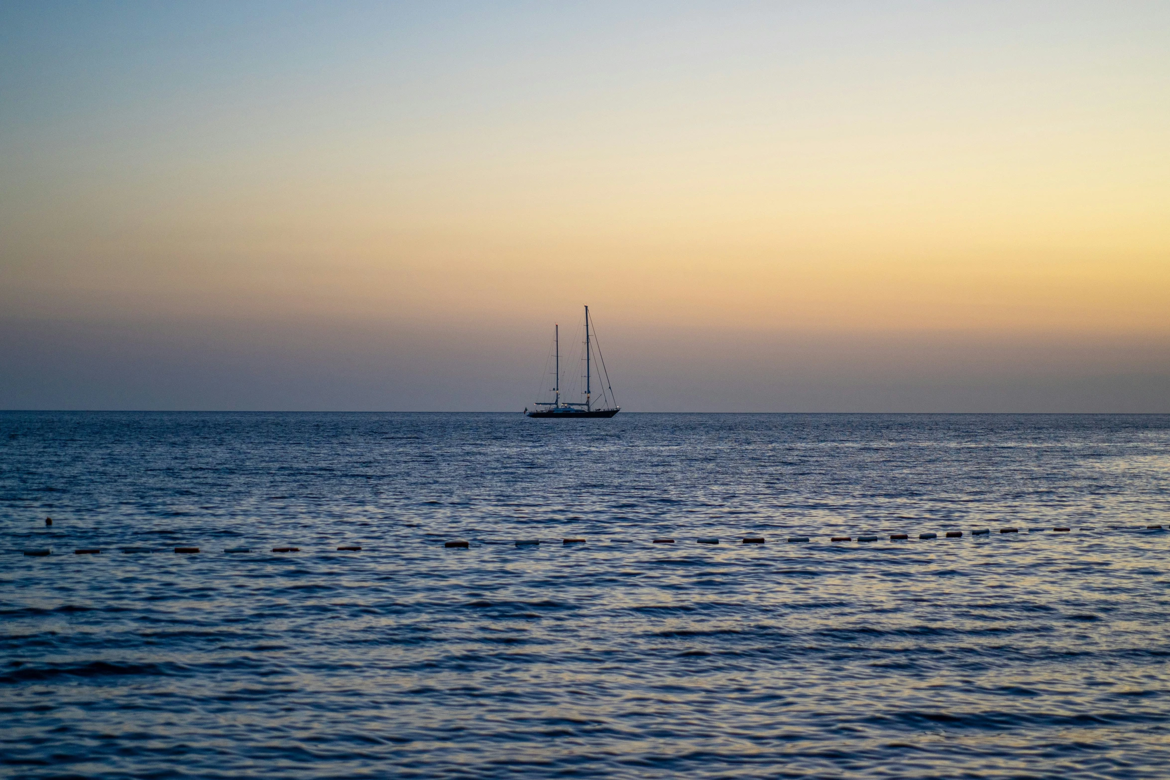 a small boat is out in the water