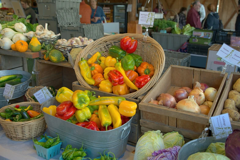 a large variety of vegetables and fruits on display in baskets