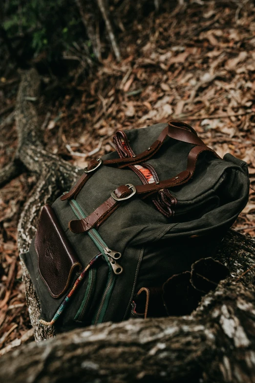 a piece of cloth sits on top of a duffel bag