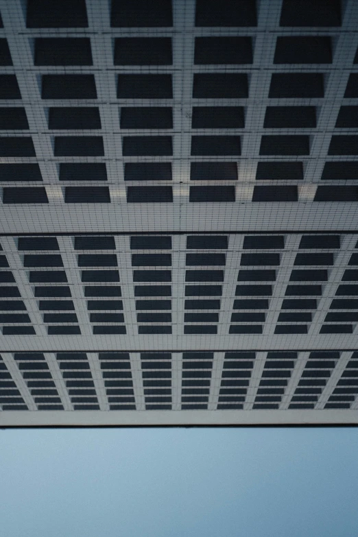 a person standing on the street in a parking garage