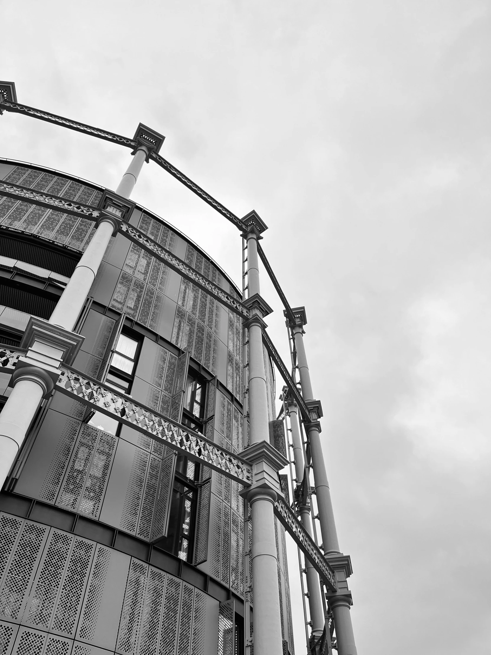 a tall building with multiple floors and metal roofing