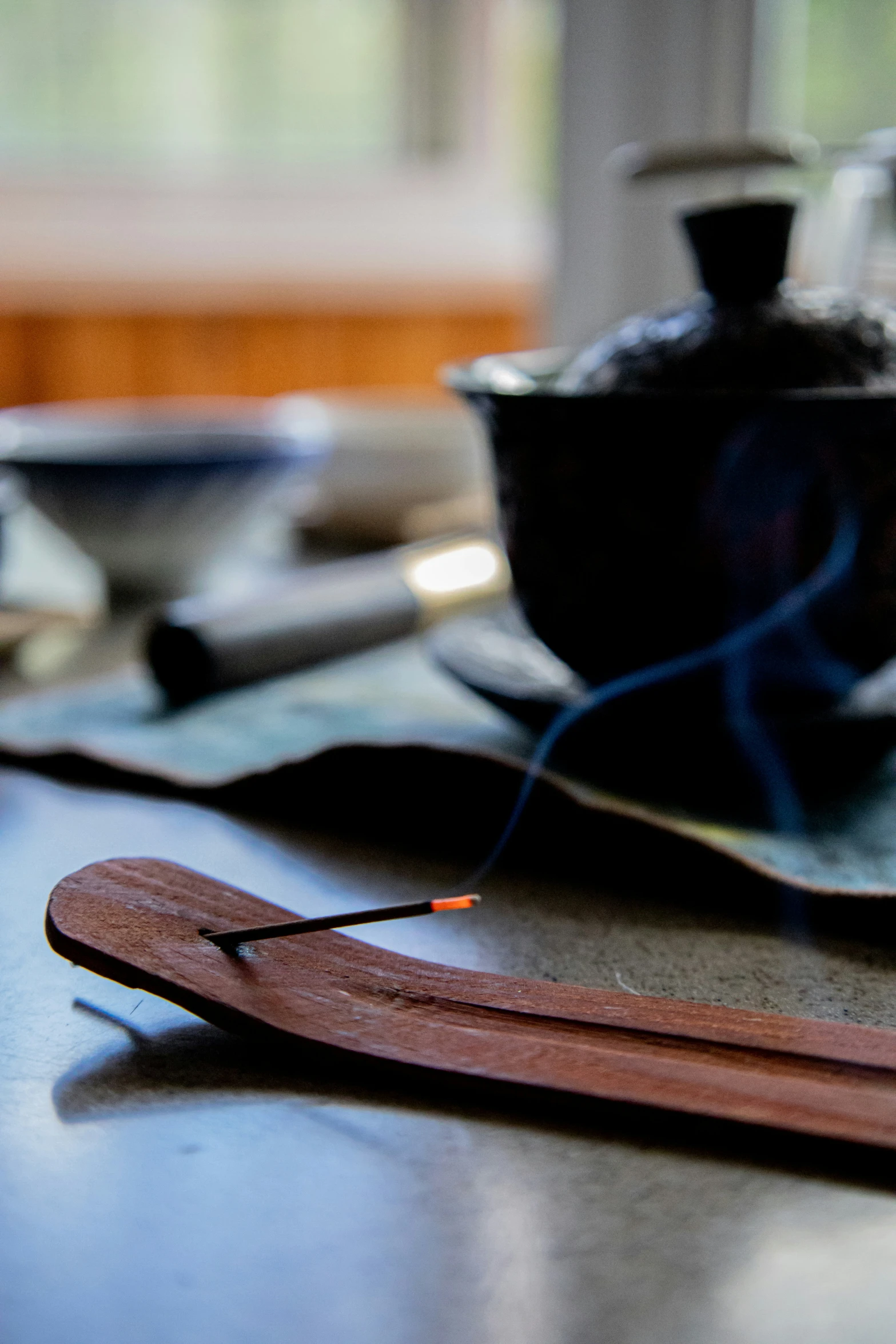 a pair of wood needles are on a plate