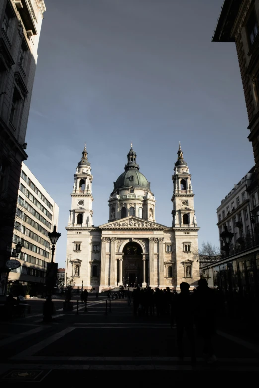 a church with two towers is seen through the opening