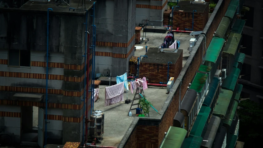 buildings and a woman hanging laundry from the clothes line