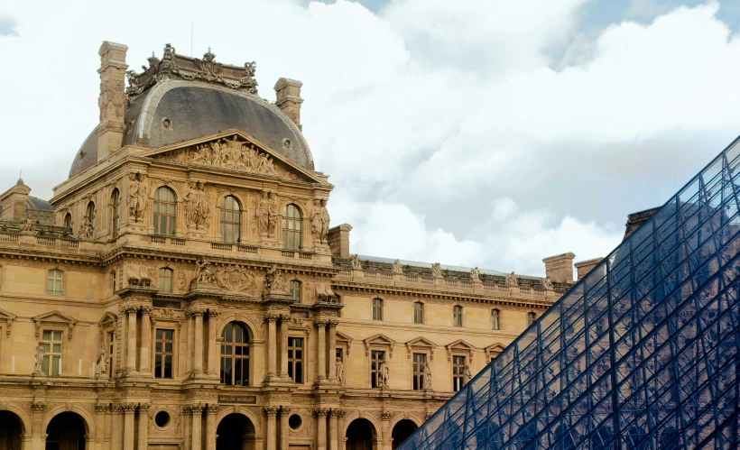 two buildings next to one another with a triangular roof