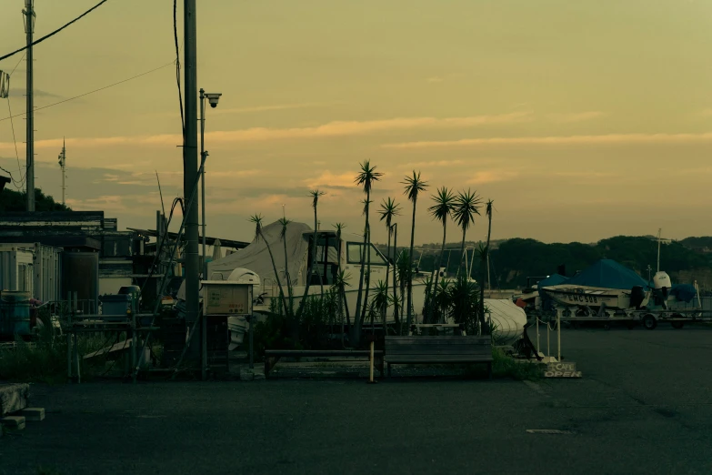 a lot full of people standing around a boat harbor