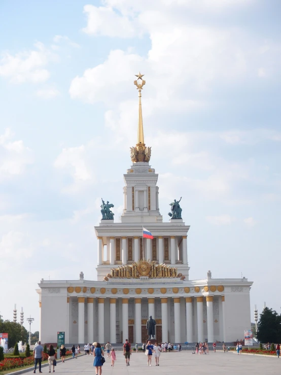 a statue on top of a building in the sky