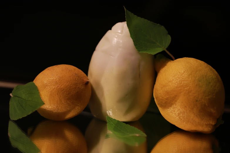 some very pretty fruit on a reflective surface