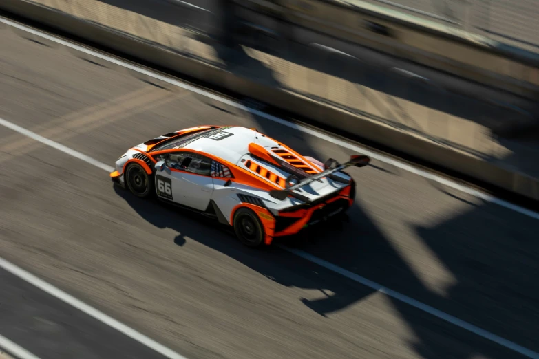 a small sports car on the road during the day