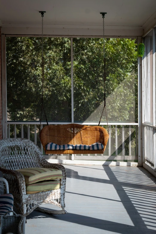 some chairs and a chair on a porch