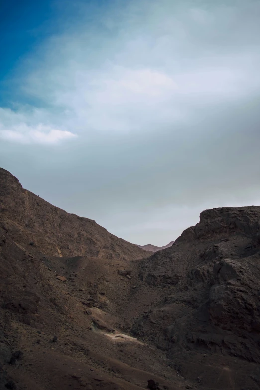 a person riding a surfboard in the middle of desert