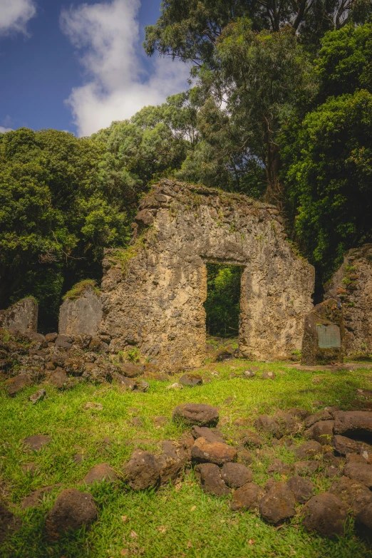 an old ruin sitting next to some trees