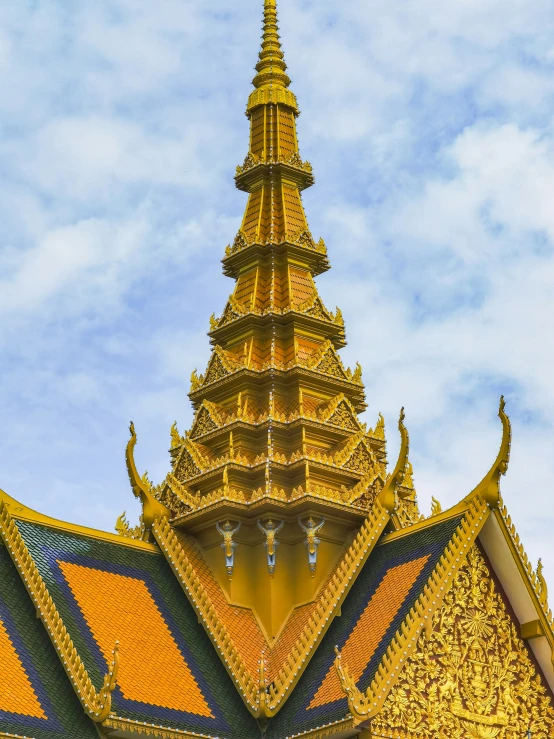 the top of a large building with a clock in the front