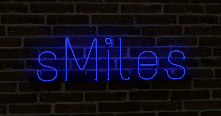 the lights glow on the sign reading smiles