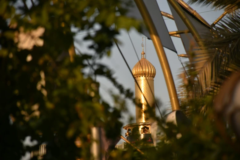 a gold colored tower with the top up