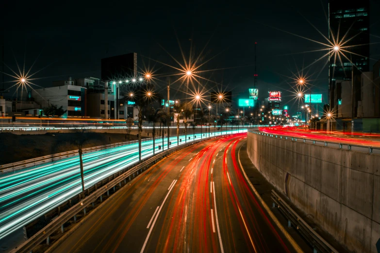 a long exposure of lights on the side of a city road