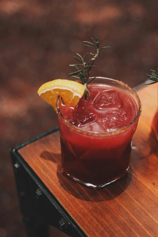 a glass filled with a y drink and garnish