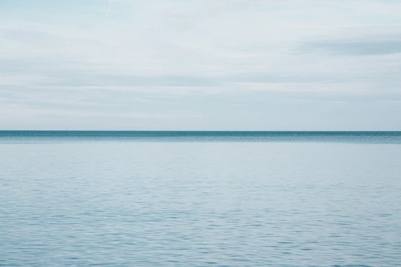 a boat is sitting out in the middle of the water