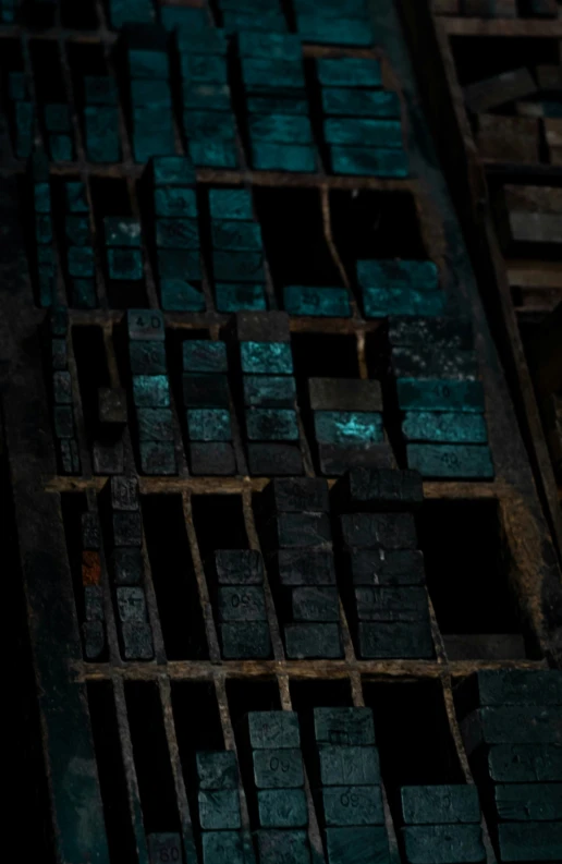 a grate of teal paint with some brown squares