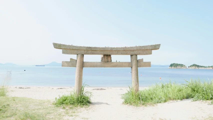a large wooden object sitting on top of a beach