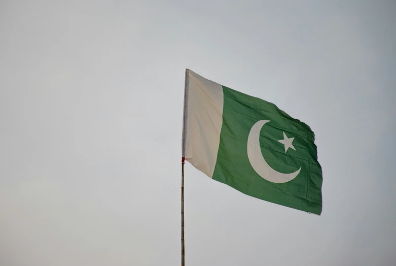 pakistan and pakistan flag flying together in the air