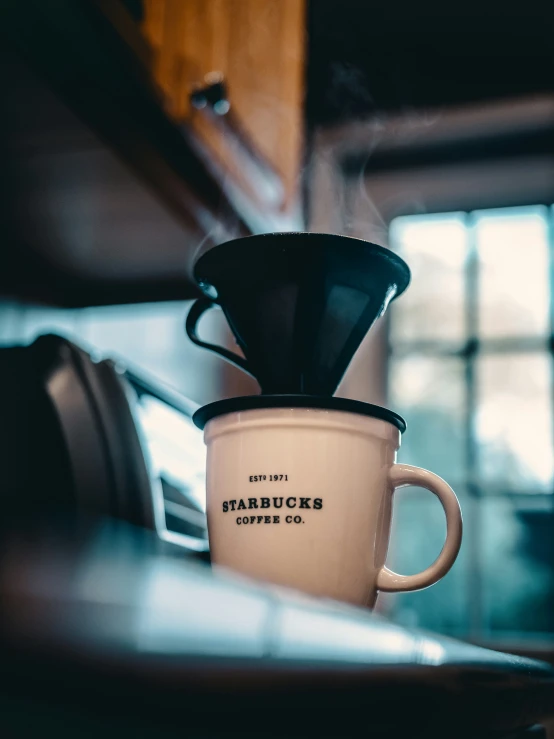 there is a coffee mug that is on the counter