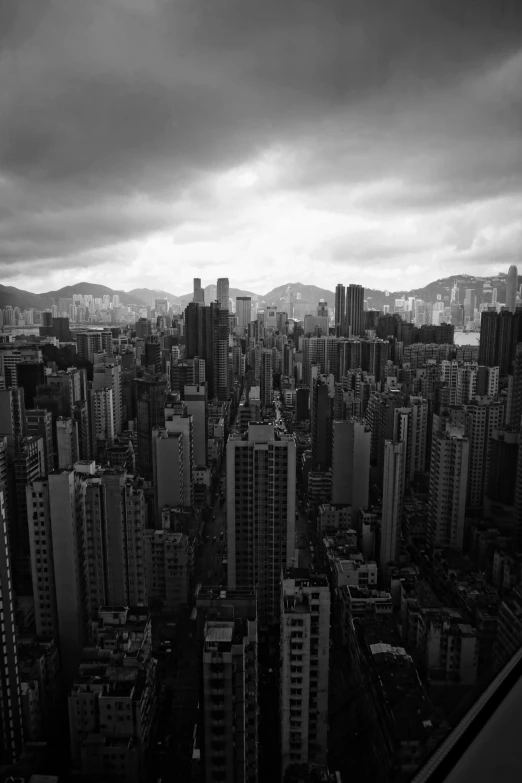 a black and white po of tall buildings in a city