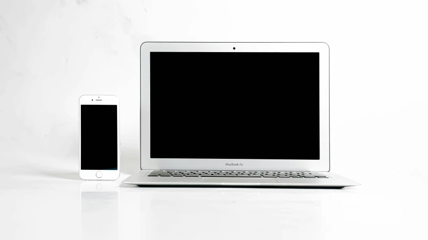 an image of a laptop and a cell phone