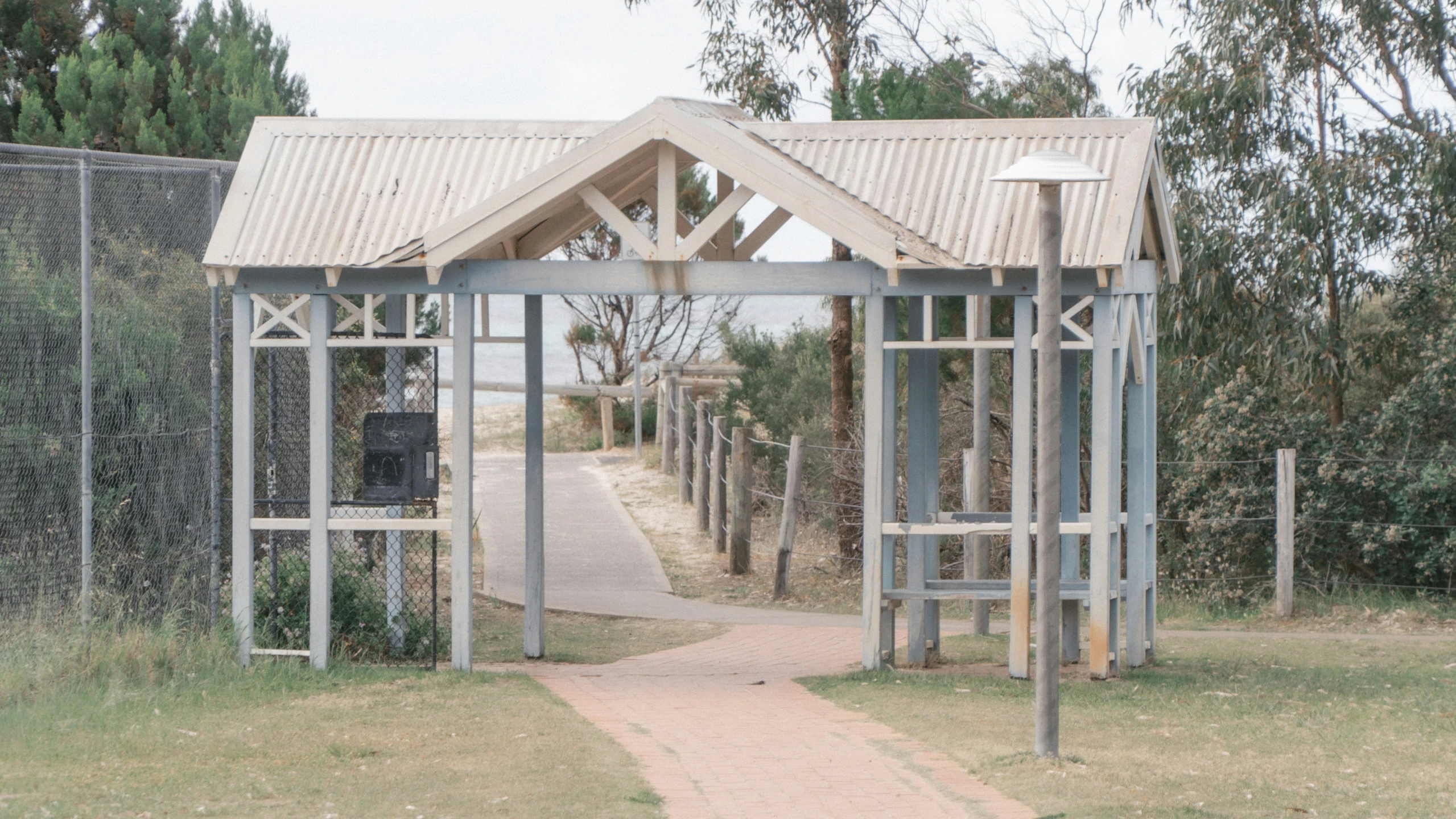 a white metal structure that looks like a shelter